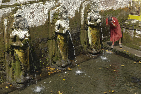 Indonesia, Bali, Bedulu, Elephant Cave. Temple of Goa Gajda. The water of youth flows out of these 6 statues of women.