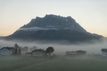 Zugspitze in the morning fog seen from Lermoos, Austria