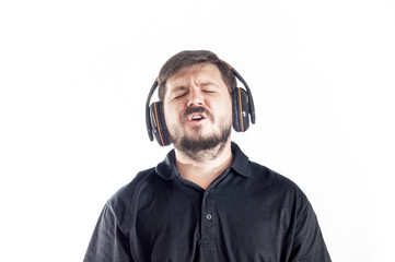 Portrait of 30 years old caucasian man sing loud song from headphones