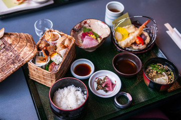 Japanese Bento lunch set with tempura and sashimi