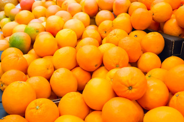 Pile of fresh oranges and mandarins