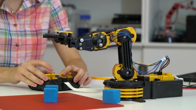 Young woman in robotics laboratory