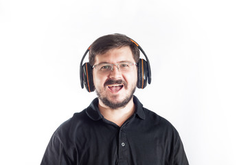 Smiling Portrait of 30 years old caucasian man listen music and singing song by headphones