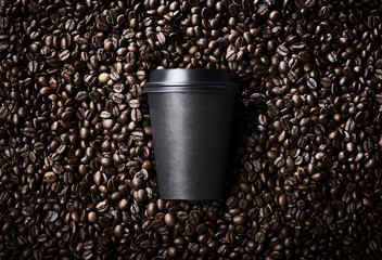 Special take away paper glass black coffee cup with toasted coffee beans around