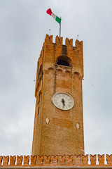 Treviso, Civic Tower close up. Ancient civic tower of Treviso in Piazza dei Signori, Treviso, Veneto, Italy. Piazza dei Signori, Treviso.