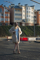 Fashionable girl on a city landscape