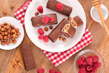 Chocolate rolls with hazelnuts and raspberries. 