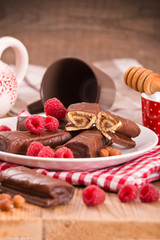 Chocolate rolls with hazelnuts and raspberries. 