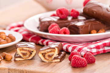 Chocolate rolls with hazelnuts and raspberries. 