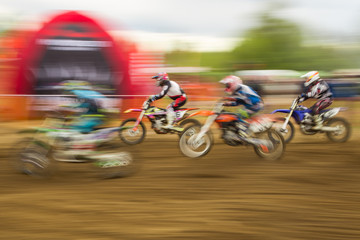 Fototapeta premium Motocross competition bike rider in motion
