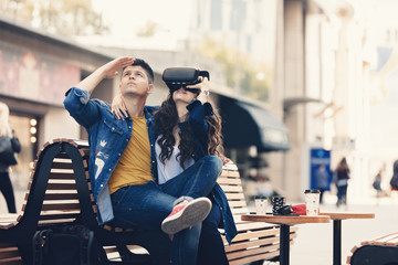 Young boy and girl game testers, using for first time VR equipment, enjoying the gear's special features and the real feel with a wearable headset equipment. Virtual Reality 360 video and 3D video