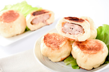 chinese traditional food pan-fried bun in white plate isolated on 

white background