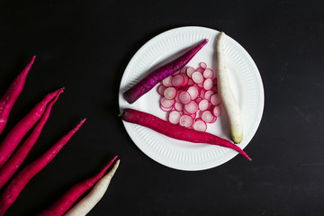 radish pink long, on a black background