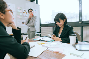 pretty business woman looking at colleague