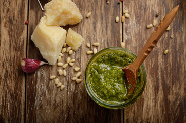 Top view of Pesto sauce and ingredients on wood table with copy-space
