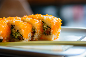 Close up tasty Japanese rolls on plate