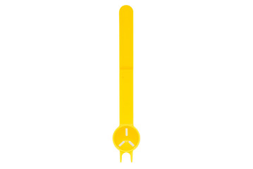 Close up unusual yellow plastic spoon isolated