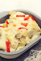 cod fish with potato and sauce on dish