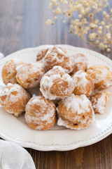 portuguese sweets cavacas on white plate on wooden background
