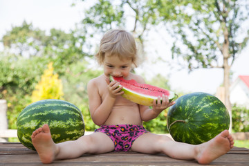 Fototapeta premium Funny little girl with watermelon slice