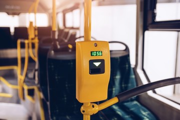 Ticket validator in modern city bus.