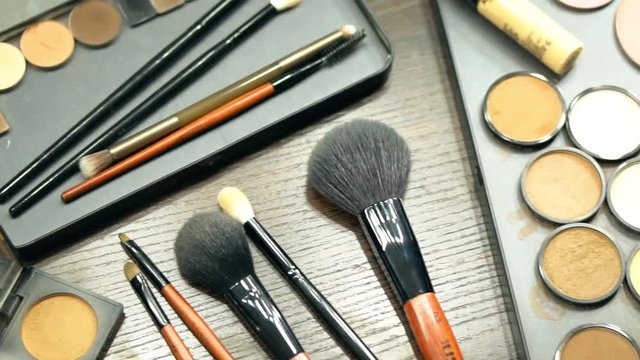 Make up artist accessories on table in dressing room