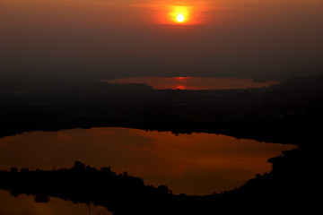 Obraz premium Annone and Pusiano lakes (northern Italy) seen from monte Barro at sunset in autumn