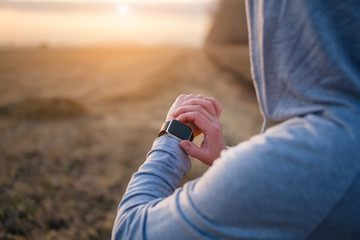 Watch for sports with smartwatch. Jogging training for marathon.