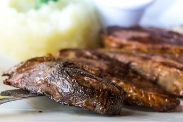 juicy steak beef meat with tomato and potatoes