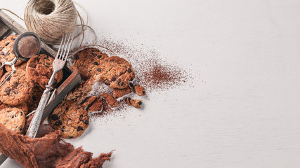 Cookies with chocolate. On a wooden background. Top view. Free space for your text.