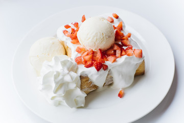 Strawberry Cream Toast on the white plate and white table.