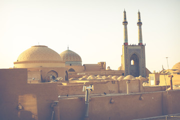 View over the Old City of Yazd, Iran and Masjed-i Jame' mosque - famous for its wind towers.