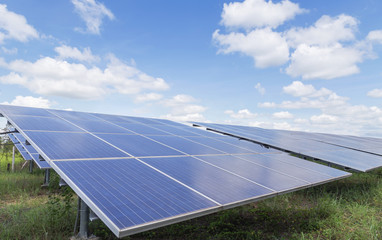 array of  polycrystalline silicon solar cells in solar power plant turn up skyward absorb the sunlight from the sun use light energy to generate electricity on blue sky background