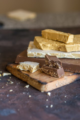 Various types of turrons,nougat, chocolate, nuts and soft nougat.