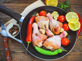 raw chicken drumsticks with spices