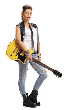 Female punker holding an electric guitar