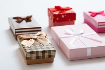  Gift boxes on white background top view. Wedding invitation, greeting card for Mother's Day. Beautiful birthday invitation.