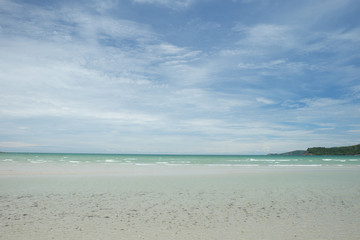 sea beach with blue sky and clouds