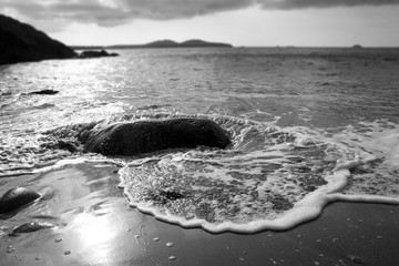 black and white photograph of Porthmelgan beach, Pembrokeshire, Wales 