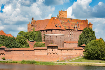 The castel in Malbork, Marienburg as seen from the river Nogat. Teutonic knights architecture in Poland.  Ordensritter and the Ordensritterstaat. 