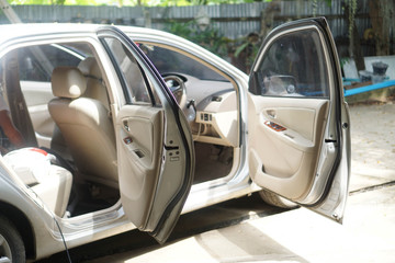 Car with all doors open, cleaning concept