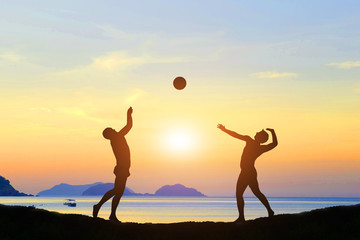 Fototapeta premium silhouette of volleyball the beach and the evening sun. 