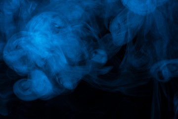 Blue smoke or steam texture on a black background