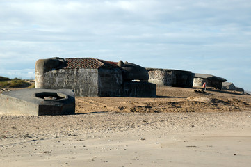 Remains of the Atlantic Wall at the beach of Thyboroen in Denmark. Built during WW2 the bunkers...