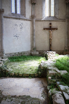 Cross in chancel - church San Giovanni di Duino, or San Givanni in Tuba - at the resurgence of the Timavo river, remains of a palaeo-Christian basilica. Trieste region, Italy