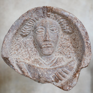 Detail, mascaron in church in San Giovanni di Duino, or San Givanni in Tuba - at the resurgence of the Timavo river, remains of a palaeo-Christian basilica. Trieste, Italy