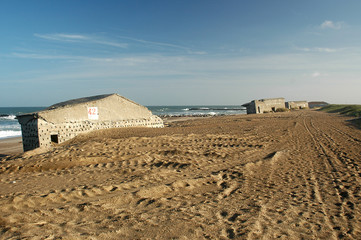 Remains of the Atlantic Wall at the beach of Thyboroen in Denmark. Built during WW2 the bunkers...