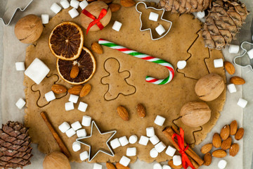 Baking Christmas cookies card. Christmas spices, cookie cutters, homemade dough and some ornament