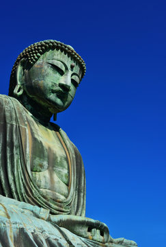 Great Buddha of Kamakura, an ancient bronze statue erected in 1252 near Tokyo, Japan (with copy space)