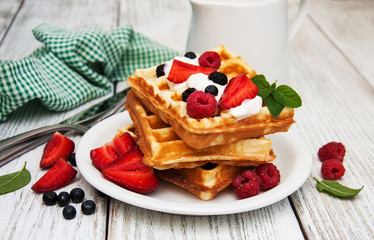 waffles with strawberries,  blueberry and milk